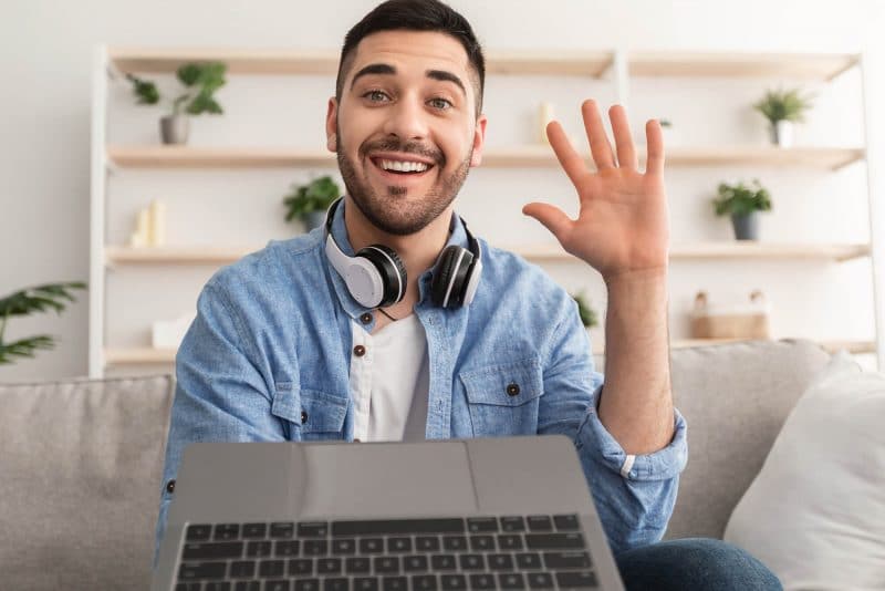 cheerful-man-having-video-call-using-laptop-and-wa-2022-02-03-00-27-59-utc-800x534-1.jpg